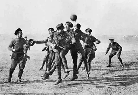 British and German soldiers playing soccer in No-Man’s Land during the Christmas Truce in 1914. Photo Credit: Universal History Archive