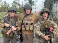 Russian oligarch Yevgeny Prigozhin [centre] poses with two Wagner Group fighters, Bakhmut in Donetsk region, Ukraine, May 25, 2023