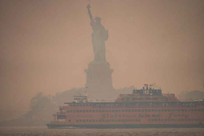 statue of liberty smoke climate change fire global warming