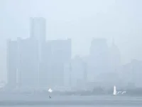 Smoke fills the sky reducing visibility Wednesday, June 28, 2023 in Detroit. [AP Photo/Paul Sancya]