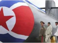 North Korean leader Kim Jong-un (second left) inspects a new nuclear-capable attack submarine at an unspecified location in North Korea, September 6, 2023. ©  KCNA