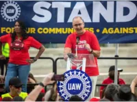 UAW President Shawn Fain speaks to hundreds of United Auto Workers during a rally outside the UAW-Ford Joint Trusts Center in Detroit on Friday, Sept. 15, 2023.
